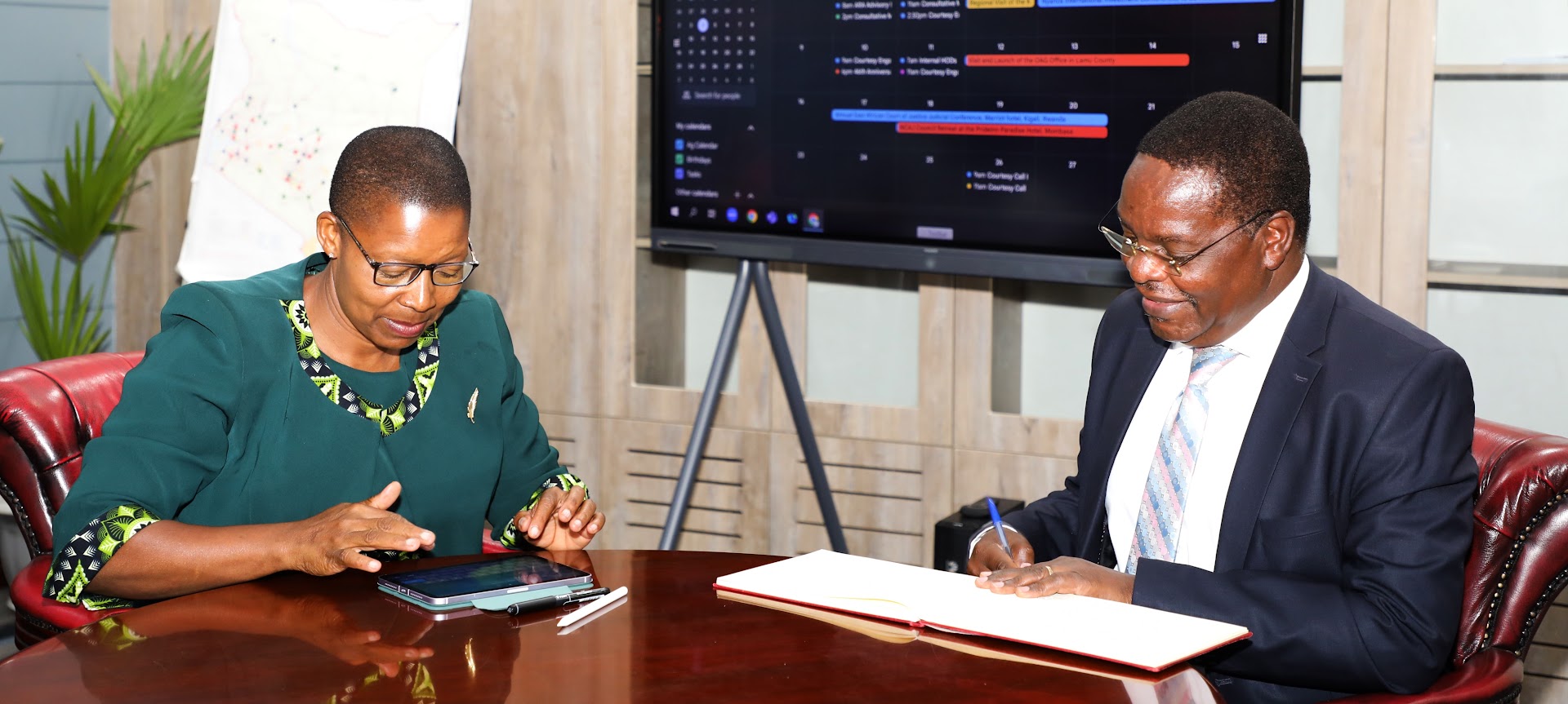 AG & Chairperson signing to a bibrant KLIF